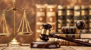 Scales of justice, a judge's gavel, and legal books